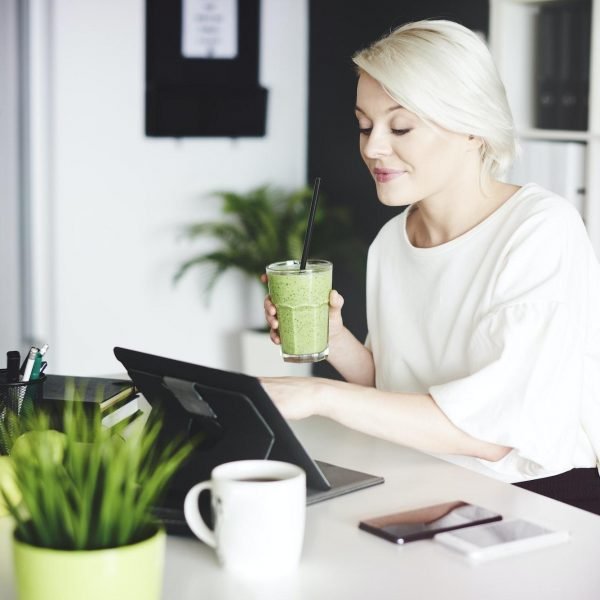 Businesswoman with digital tablet working at home